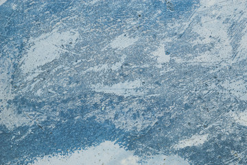 Blue coloured texture wall / Abstract blue and white drawing loose concrete wall. Paint in poor condition.