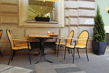 table and chairs in a street cafe