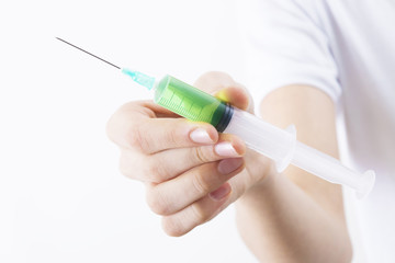 hand with syringe or vaccine isolated in white background