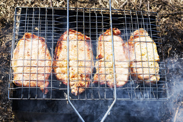 pork steak on the grill in the smoke