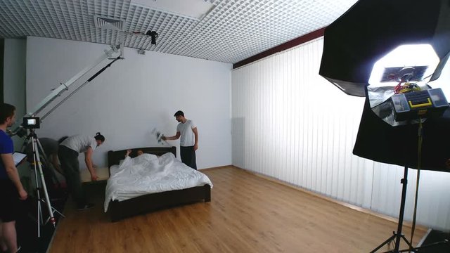 The shooting process of a couple in the bed. time lapse