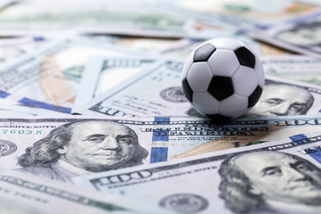 Soccer ball on dollar banknotes