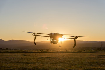 Fototapeta na wymiar Long endurance professional drone prototype Flying at dusk