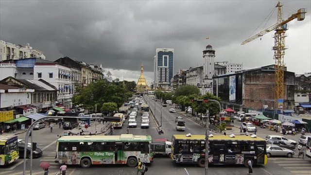 Buses driving in Yangon (Rangoon), Myanmar (Burma)