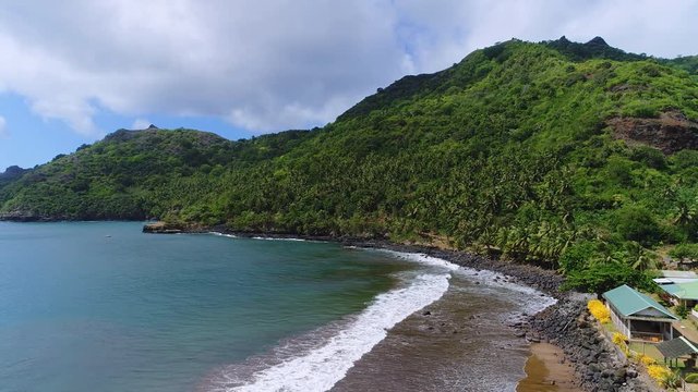 Aerial panoramic view of Hatiheu Bay on Nuku Hiva island - South Pacific Ocean, Marquesas Islands, landscape of French Polynesia from above, 4k