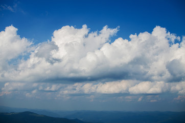 Obraz premium furry clouds on a blue sky on a beautiful summer