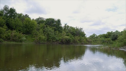 Obraz premium A wide river in the forest. The Hopper River.