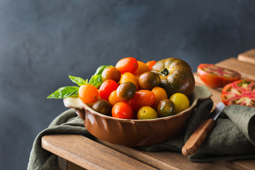 Assortment of ripe organic farmer cherry tomatoes on a table