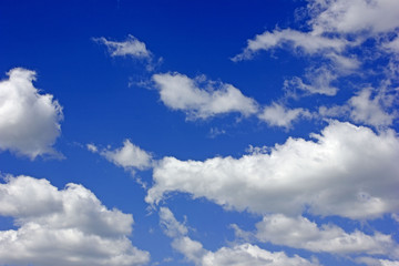 Naklejka na ściany i meble White clouds on blue sky background 