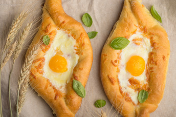 Khachapuri traditional Georgian cheese and egg-filled bread