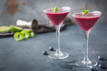 Alcohol frozen blueberry cocktail margarita with tequila and lime