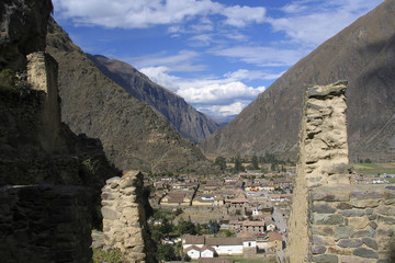 The town of Ollantaytambo, Peru, an Inca archaeological site, seen from the ruins of Machu Pichu, Peru