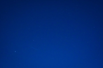 Bright City Meteor Shower in Night Sky