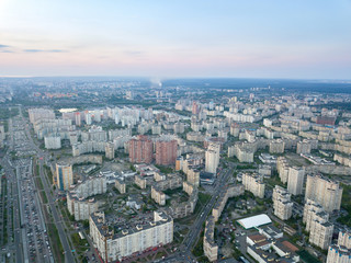 Fototapeta na wymiar A bird's eye view, aerial panoramic view from drone to the Darnyts'kyi district of Kiev, Ukraine and the left bank of Dnieper.