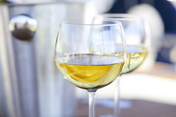 Pair of wineglasses against the yacht