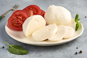 Mozzarella Buffalo with basil leaves and tomatoes.