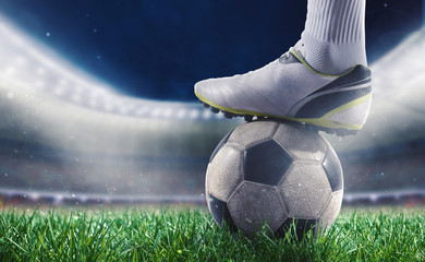 Soccer player with soccerball at the stadium ready for World cup