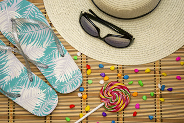 summer mood - a hat, glasses, sweets, flip-flops