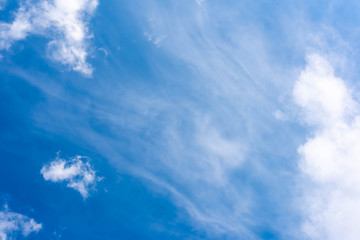 White clouds on a dark blue sky, fantastic contrast, background