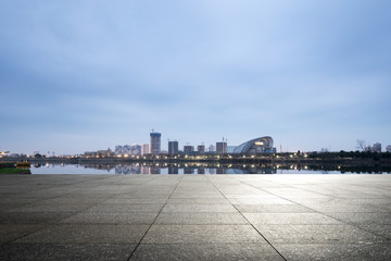Fototapeta premium empty ground with modern city skyline