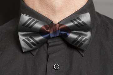 Man Dressed Black Shirt With Bow Tie with South Korean Flag
