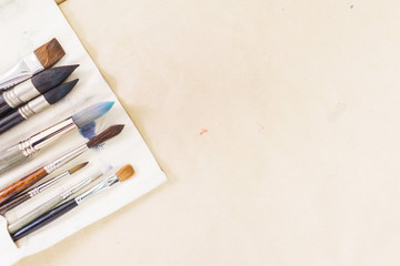 Top view of artist's tools while working with watercolor paint. 