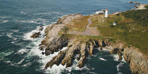 Lighthouse in Louisbourg Nova Scotia Cape Breton along Atlantic Canadian Coastline.