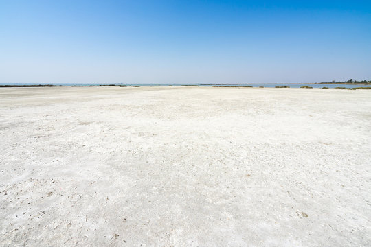 Arid landscape of the evaporation pools of Margherita di Savoia salt flats, Apulia, Italy