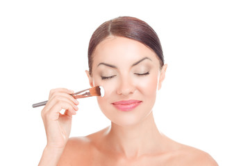 Woman girl applying cosmetic cream creamy mask on her face