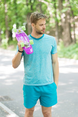 Still childish. Man calm face carries penny board park nature background, defocused. Guy carries...