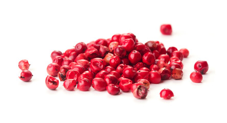 heap of pink peppercorn isolated on white background