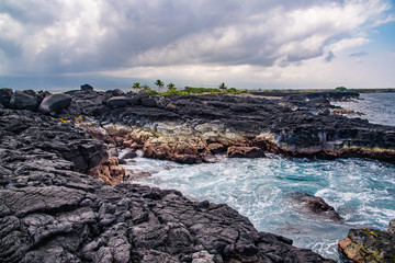 Fototapeta na wymiar Lava rock by the ocean