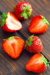 Slices of strawberry on wooden  table background