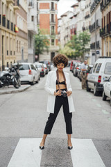Female Photographer Holding an Old Analog Camera