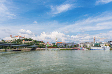 Fototapeta na wymiar Bratislava, Slovakia - May 24, 2018: The panorama of Bratislava photographed over the Danube River 