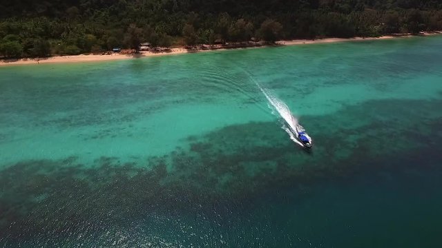 Aerial view of a traditional boat in the paradisiacal sea of Koh Rok Yai island.