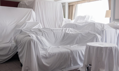 White dust cover cloth covering furnitures in a room - 208996146