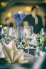 Empty wine glasses placed on a dinner table.