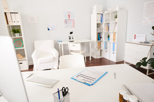 Background Image Of Empty White Doctors Office Interior With Desk In Foreground  In Modern Private Clinic, Copy Space