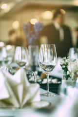 Empty wine glasses placed on a dinner table.