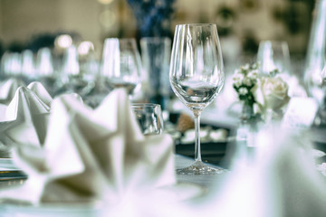 Empty wine glasses placed on a dinner table.
