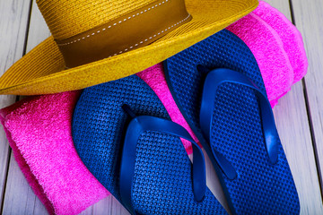 Pair of new blue flip flops against white background