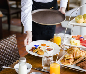 Waitress serving breakfast at a restaurant