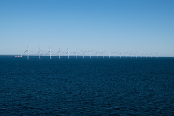 Row of wind turbines in Baltic Sea between Germany and Denmark