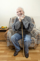 The old man in the armchair at home