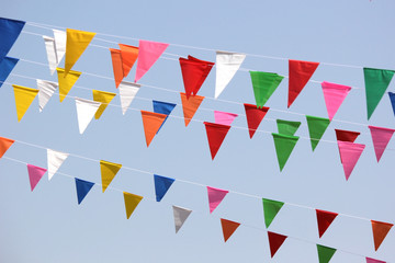 Obraz premium colorful triangle flag with sky background