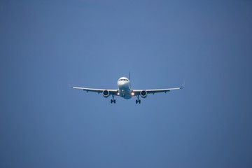 Fototapeta na wymiar airplane on blue sky