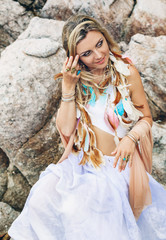 beautiful young boho style woman in white dress on stone beach © zolotareva_elina