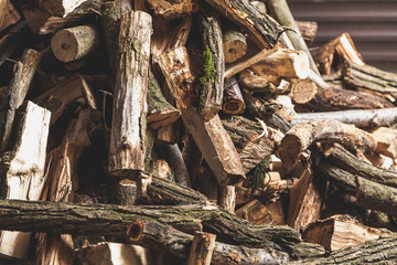 firewood of different shapes piled with bunch