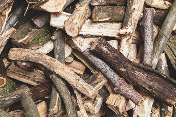 firewood of different shapes piled with bunch